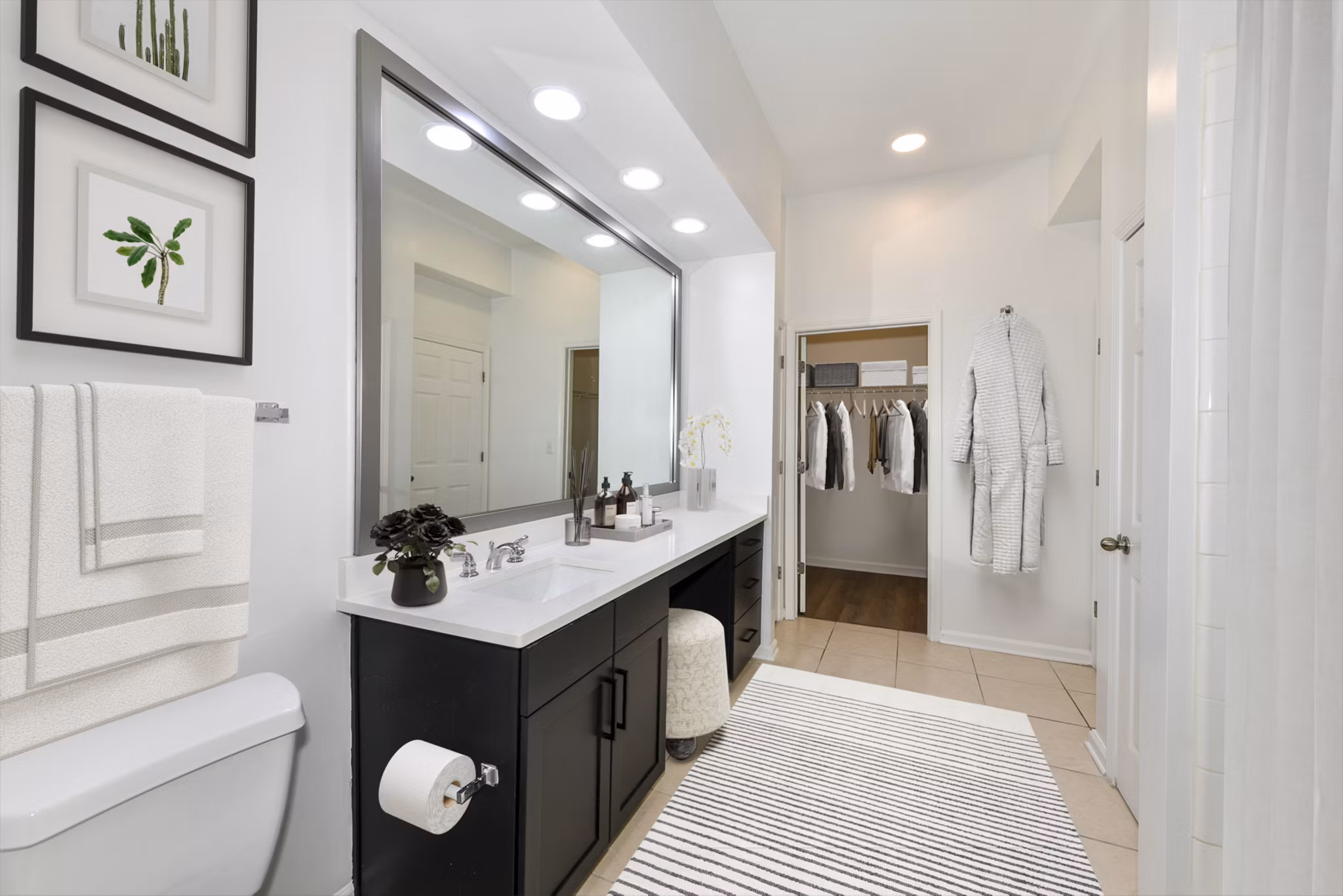 Elegant bathroom with marble countertops and modern fixtures at Kingsboro Luxury Apartments