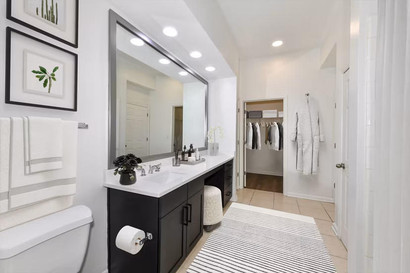 Elegant bathroom with marble countertops and modern fixtures at Kingsboro Luxury Apartments