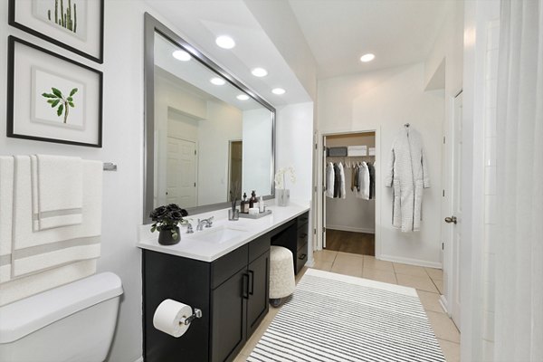 Elegant bathroom with marble countertops and modern fixtures at Kingsboro Luxury Apartments