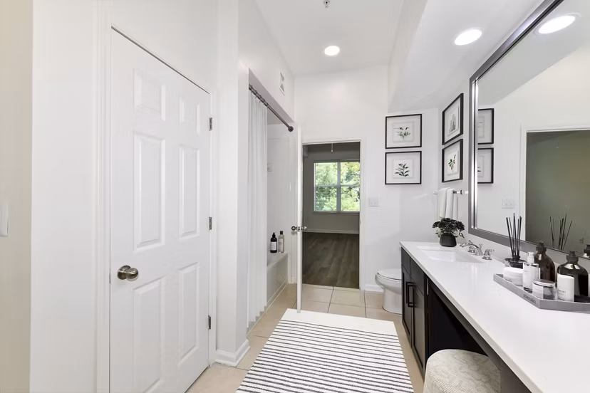 Kingsboro Luxury Apartments: Modern bathroom with sleek fixtures and marble countertop