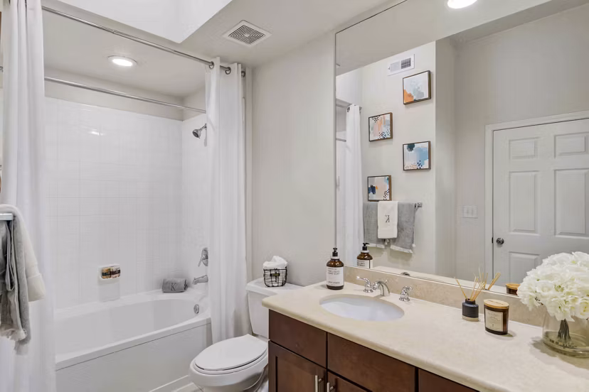 Modern bathroom featuring sleek countertops and designer fixtures at Kingsboro Luxury Apartments in Atlanta