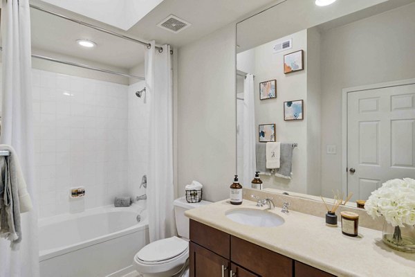 Modern bathroom featuring sleek countertops and designer fixtures at Kingsboro Luxury Apartments in Atlanta