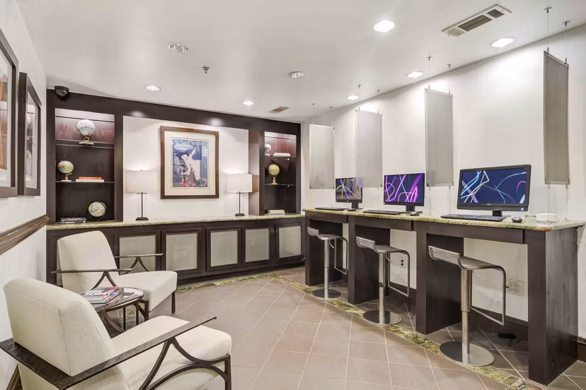 Business center with modern workstations at Kingsboro Luxury Apartments Perfect for remote work and professional meetings