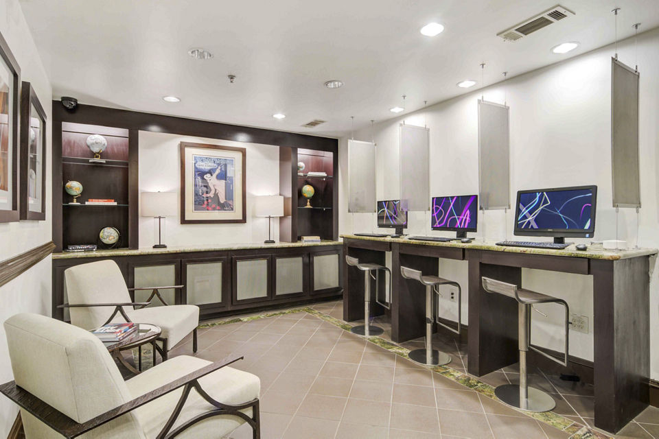 Business center with modern workstations at Kingsboro Luxury Apartments Perfect for remote work and professional meetings