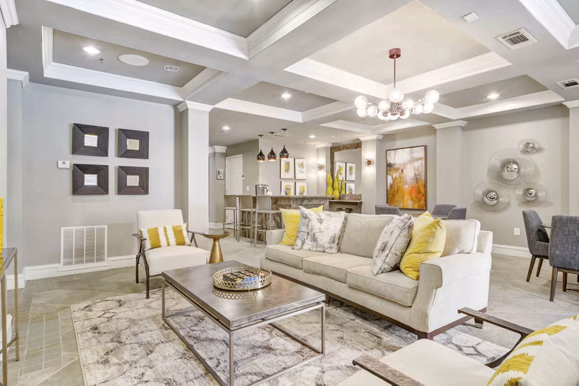 Modern clubhouse with elegant seating and fireplace at Kingsboro Luxury Apartments