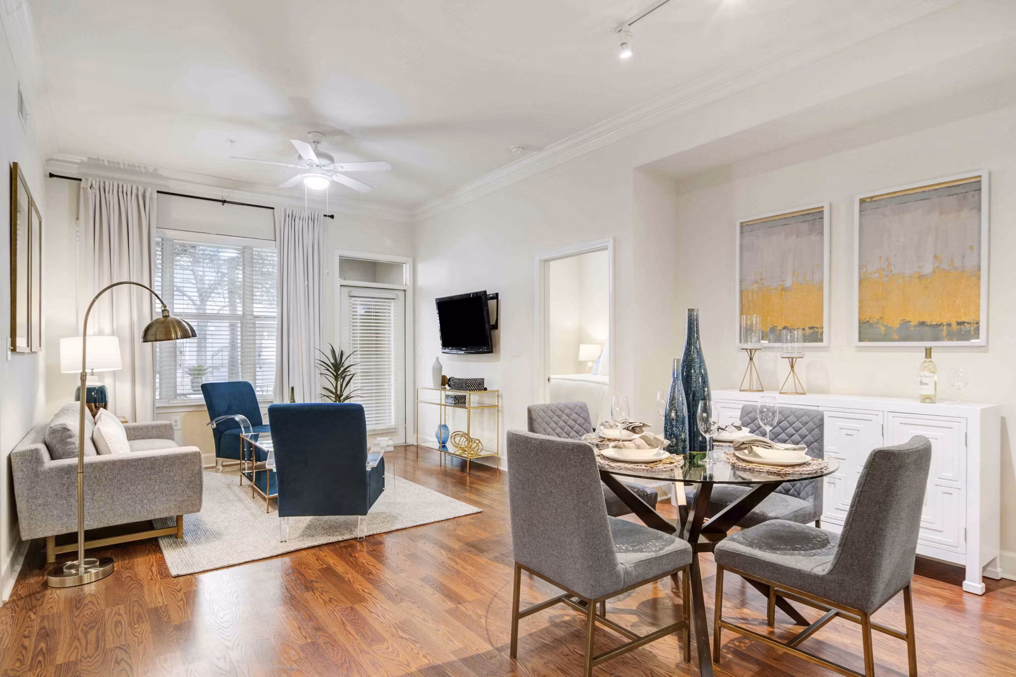 Dining area with modern dÃ©cor and elegant lighting at Kingsboro Luxury Apartments