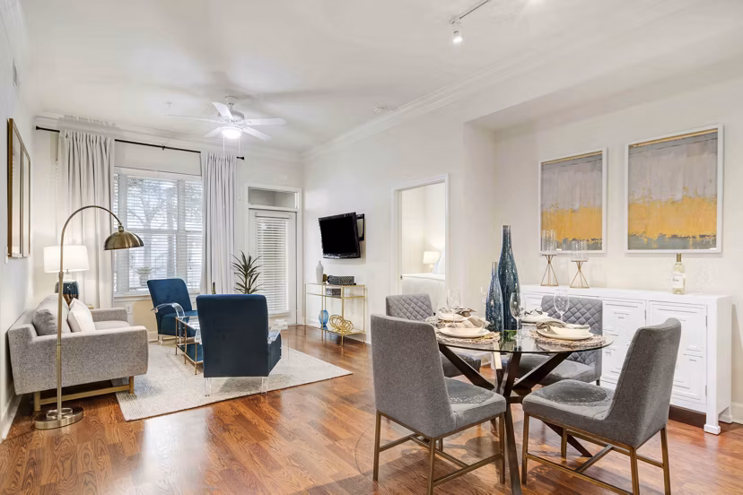 Dining area with modern dÃ©cor and elegant lighting at Kingsboro Luxury Apartments