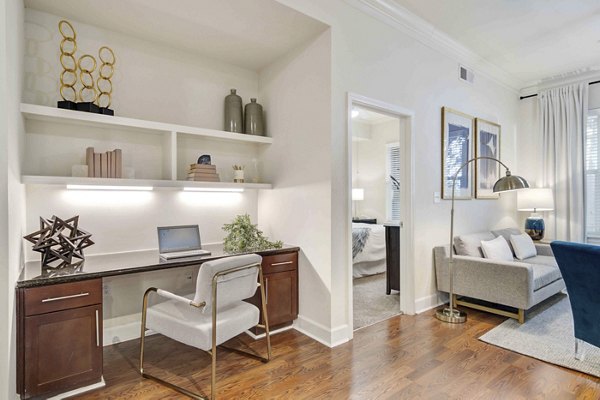 Home office with modern furnishings and natural light at Kingsboro Luxury Apartments