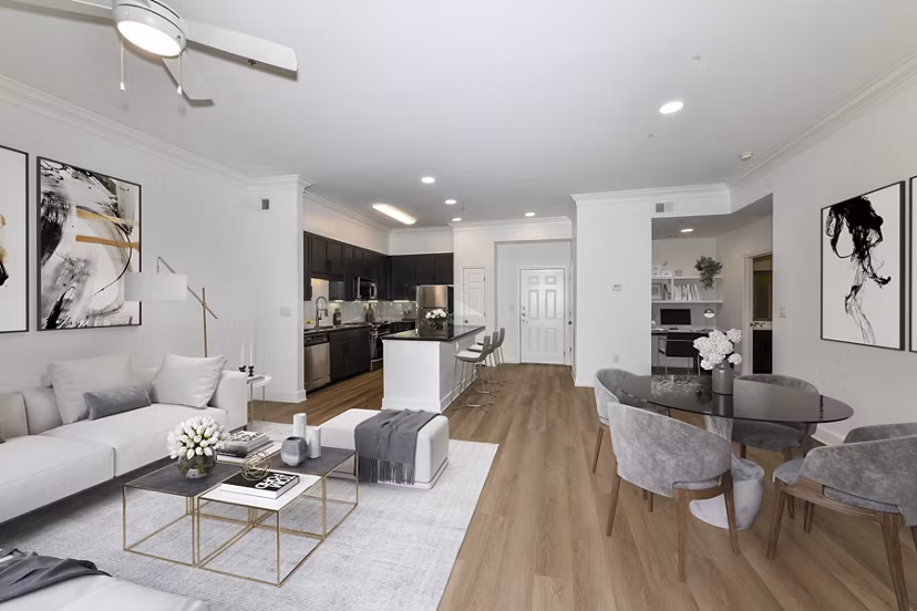 Living room with elegant furnishings and natural light at Kingsboro Luxury Apartments