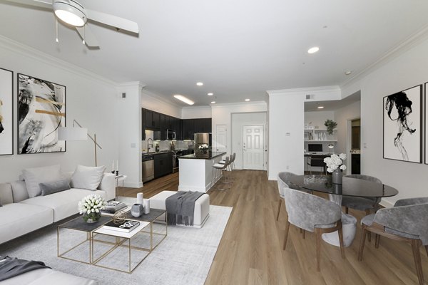 Living room with elegant furnishings and natural light at Kingsboro Luxury Apartments