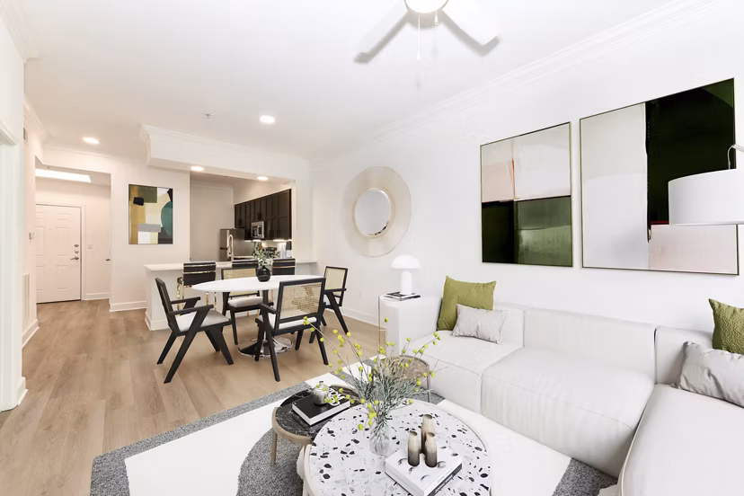 Elegant living room with modern decor at Kingsboro Luxury Apartments, featuring ample natural light and premium finishes