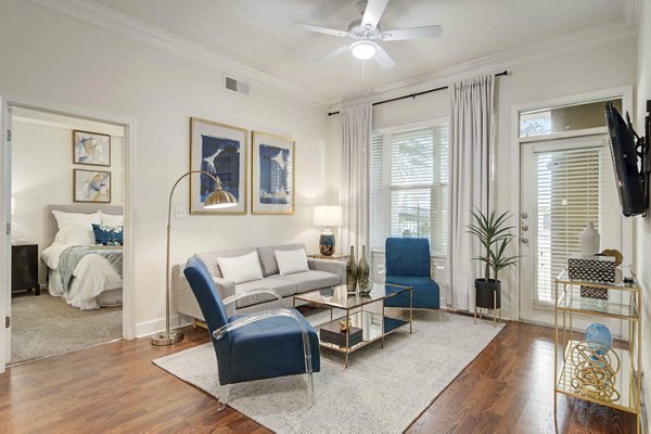 Spacious living room with contemporary furnishings in Kingsboro Luxury Apartments