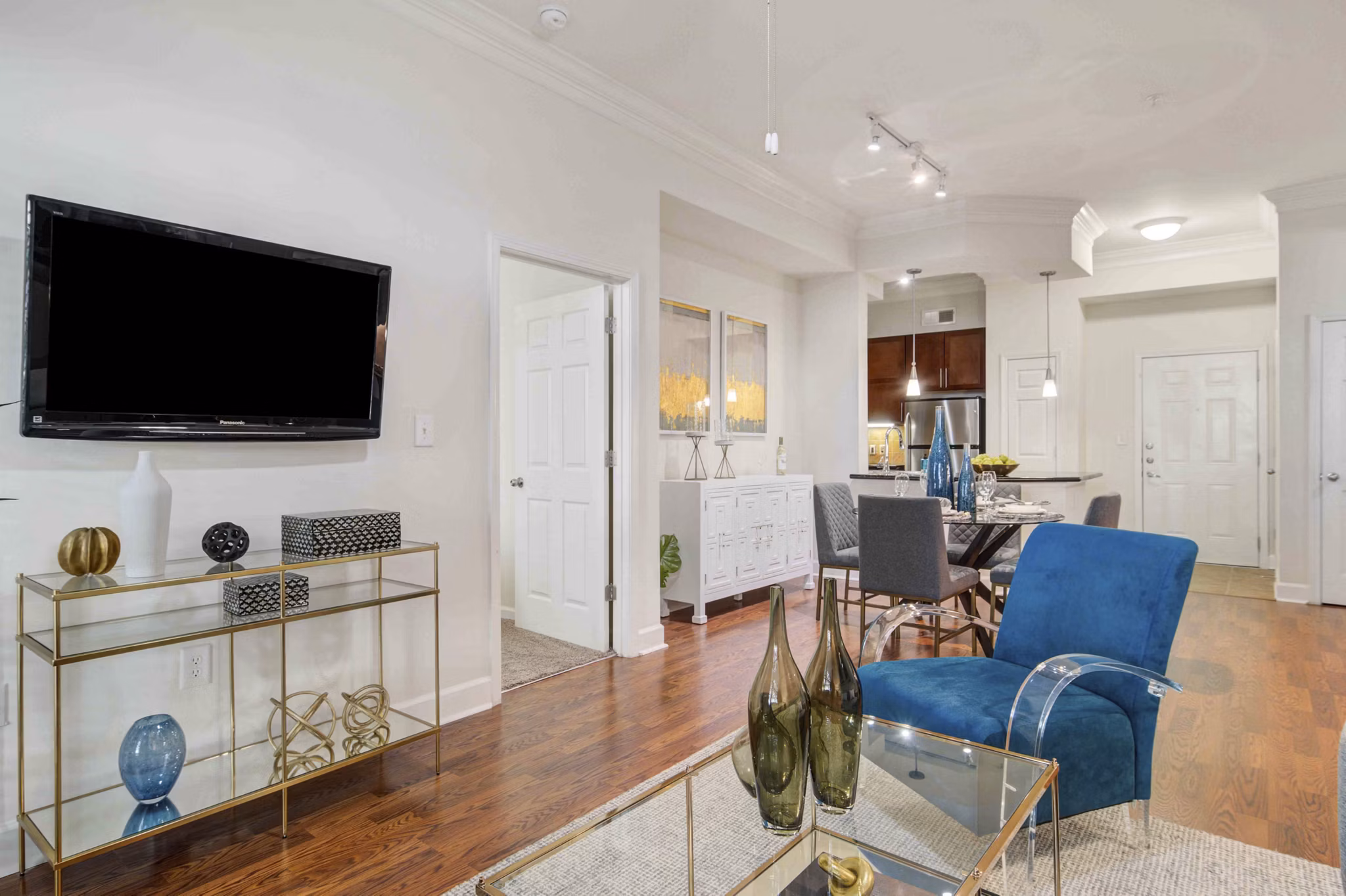Cozy living room with modern decor at Kingsboro Luxury Apartments