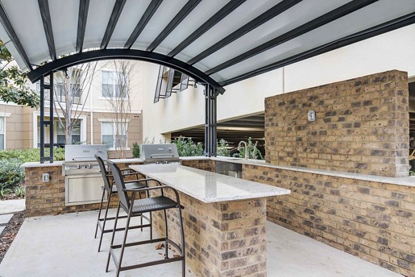 Modern grill area with stainless steel appliances at Kingsboro Luxury Apartments