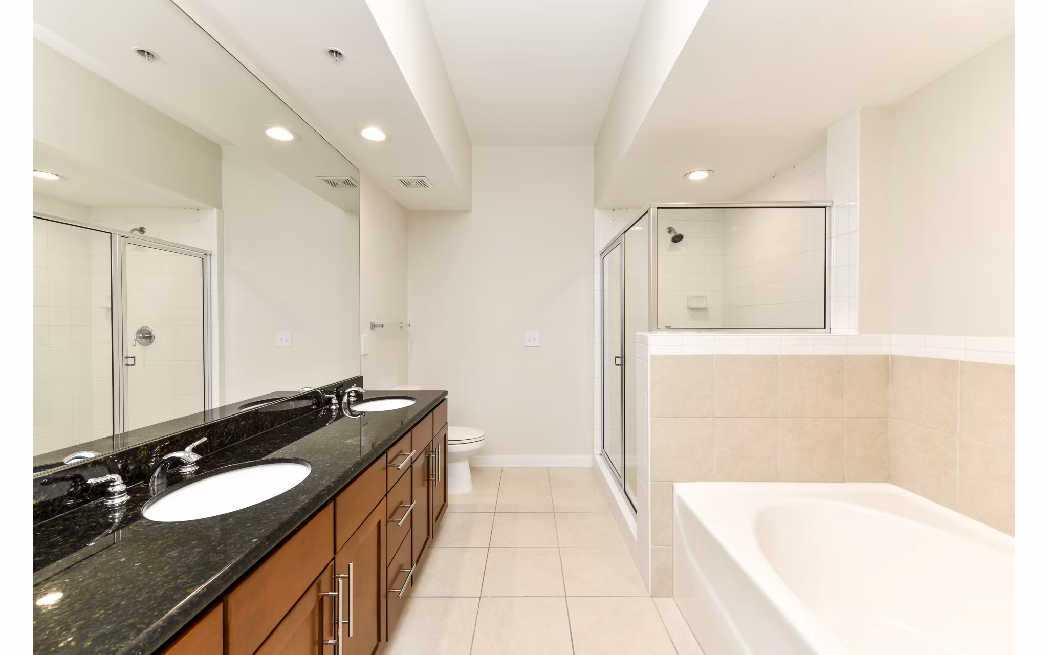 Modern bathroom with marble countertops and sleek fixtures at Peachtree Dunwoody Place Apartments