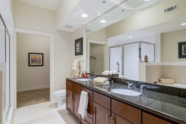 Elegant bathroom with marble countertops and dual sinks at Peachtree Dunwoody Place Apartments