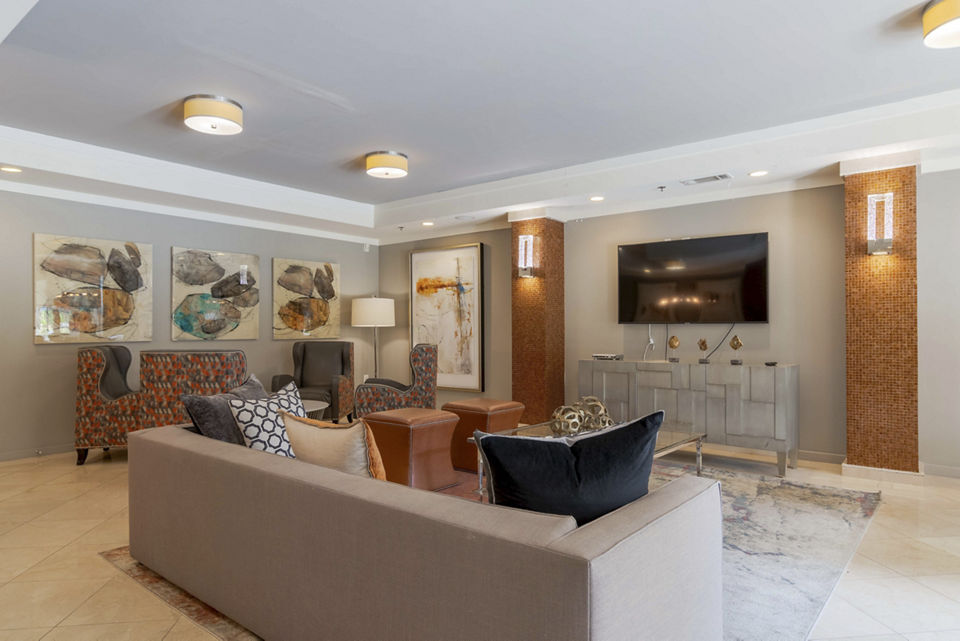 Elegant clubhouse at Peachtree Dunwoody Place Apartments with modern decor and ample seating areas for community gatherings