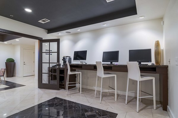 Stylish clubhouse with modern decor and seating at Peachtree Dunwoody Place Apartments
