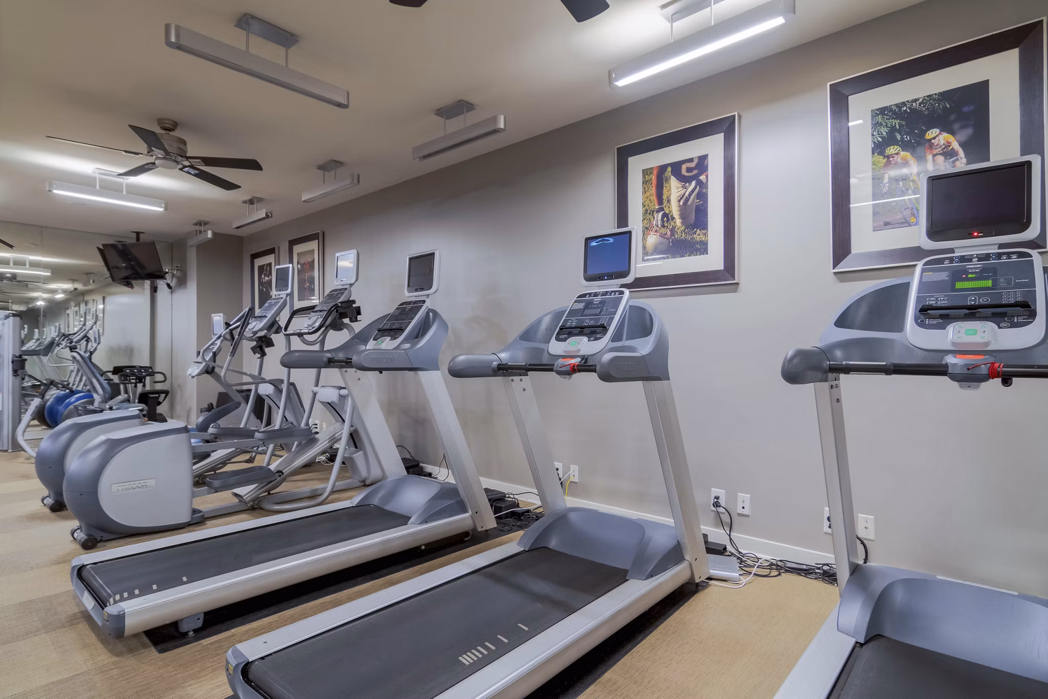 Modern fitness center with state-of-the-art equipment at Peachtree Dunwoody Place Apartments in an upscale community