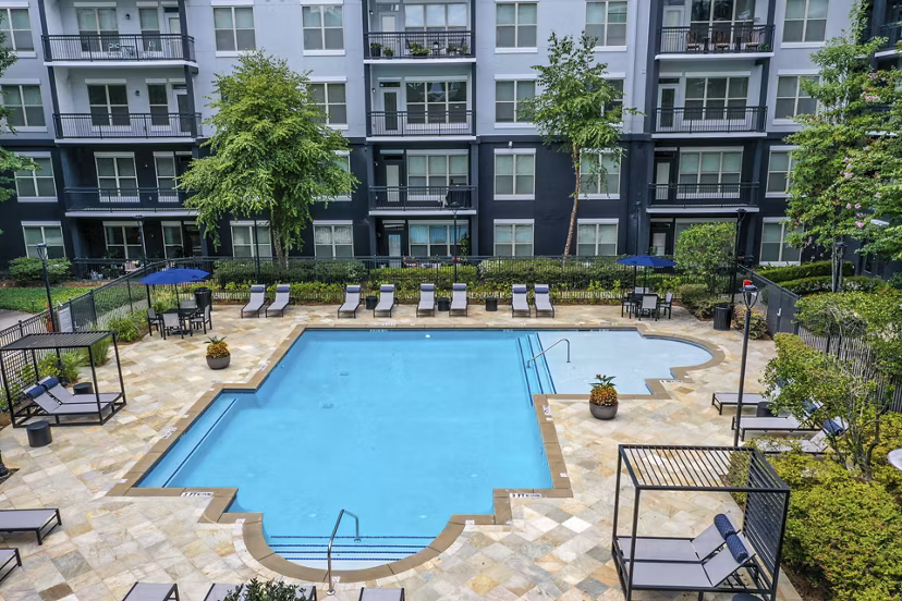 Resort-style pool at Peachtree Dunwoody Place Apartments, offering luxury leisure in Atlanta