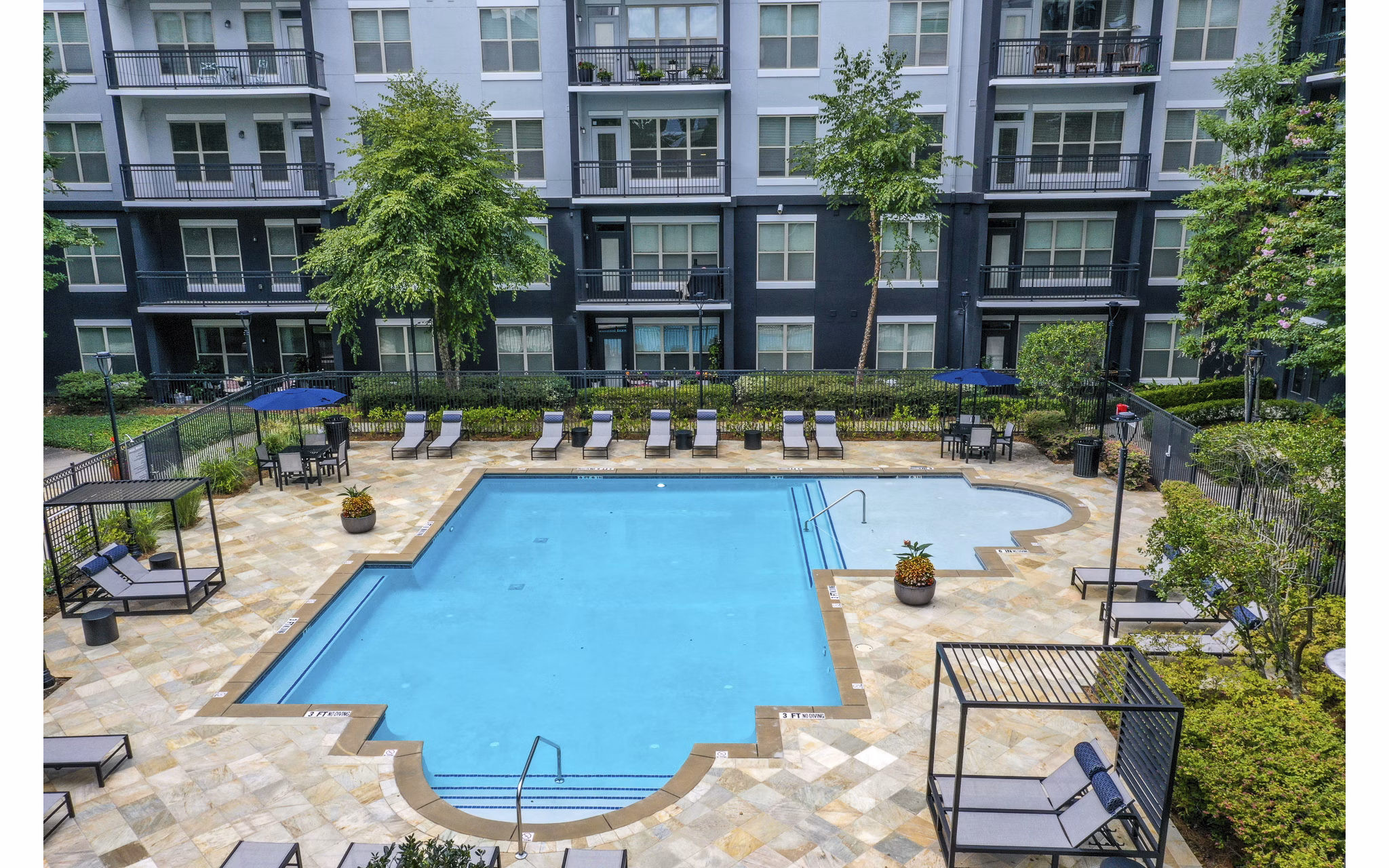 Resort-style pool at Peachtree Dunwoody Place Apartments, offering luxury leisure in Atlanta