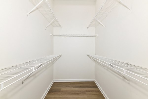 Spacious bedroom closet with built-in shelves at Phipps Place Apartments, luxury living in a prime location