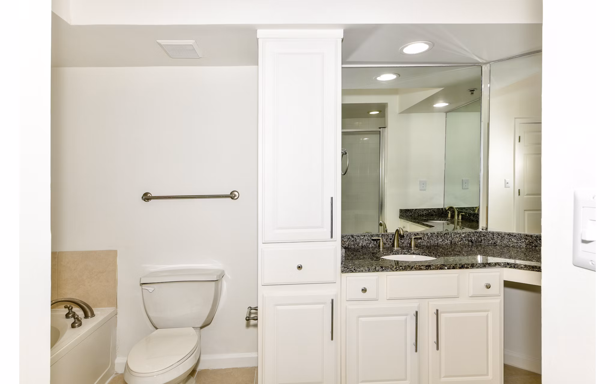 Modern bathroom featuring sleek fixtures and a glass shower at Phipps Place Apartments, luxury living in a prime location