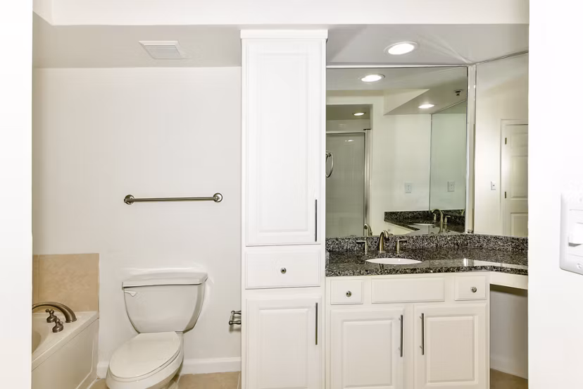 Modern bathroom featuring sleek fixtures and a glass shower at Phipps Place Apartments, luxury living in a prime location