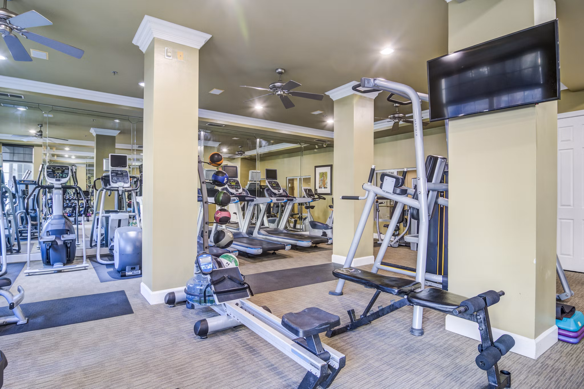 State-of-the-art fitness center with modern equipment at Phipps Place Apartments