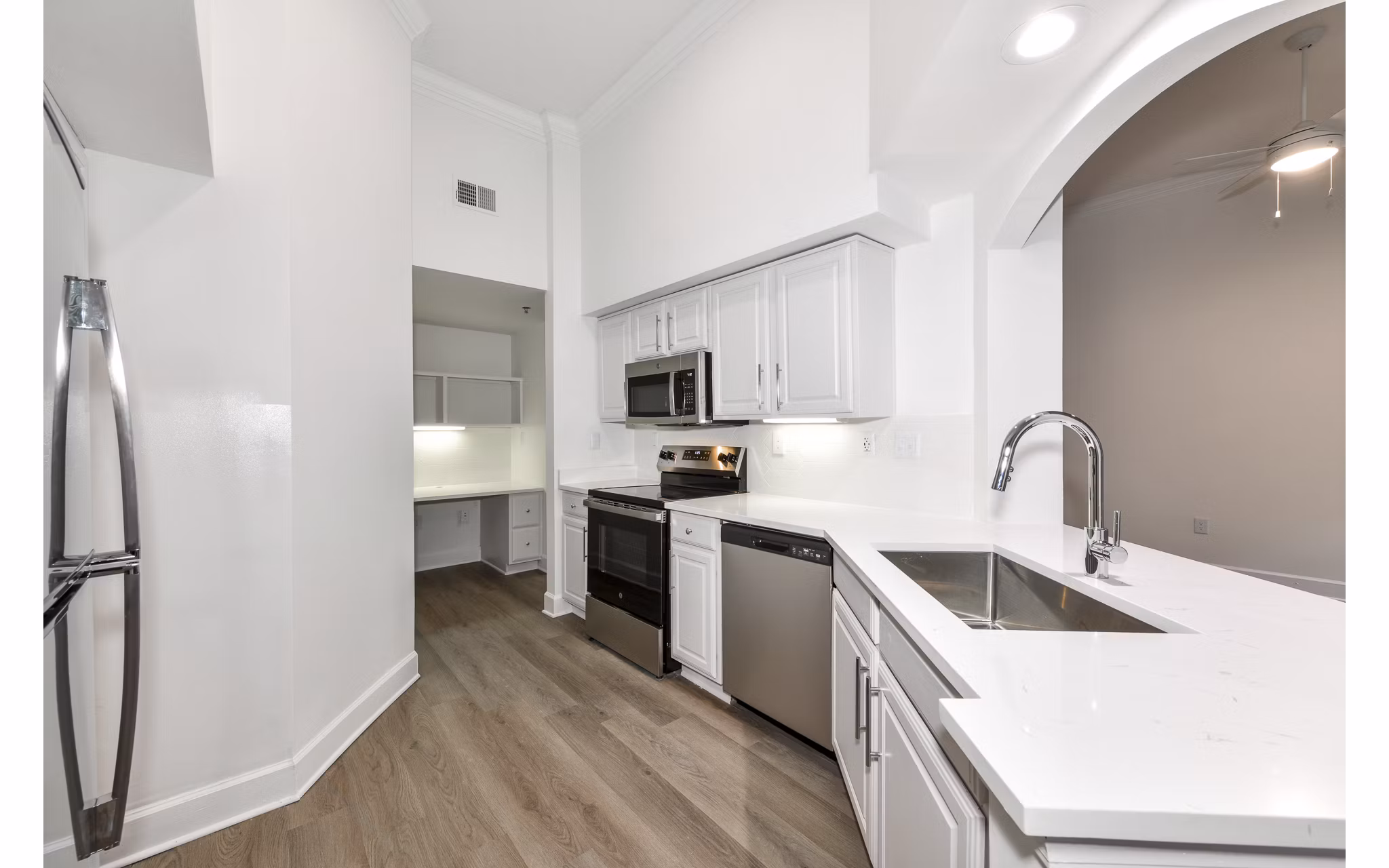 Modern kitchen with stainless steel appliances at Phipps Place Apartments, luxury living in the heart of the city