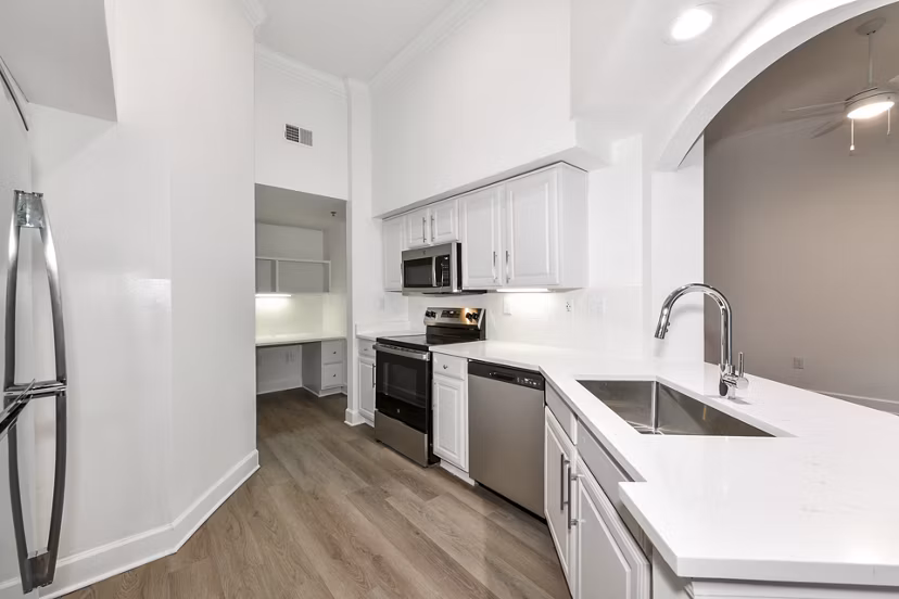 Modern kitchen with stainless steel appliances at Phipps Place Apartments, luxury living in the heart of the city