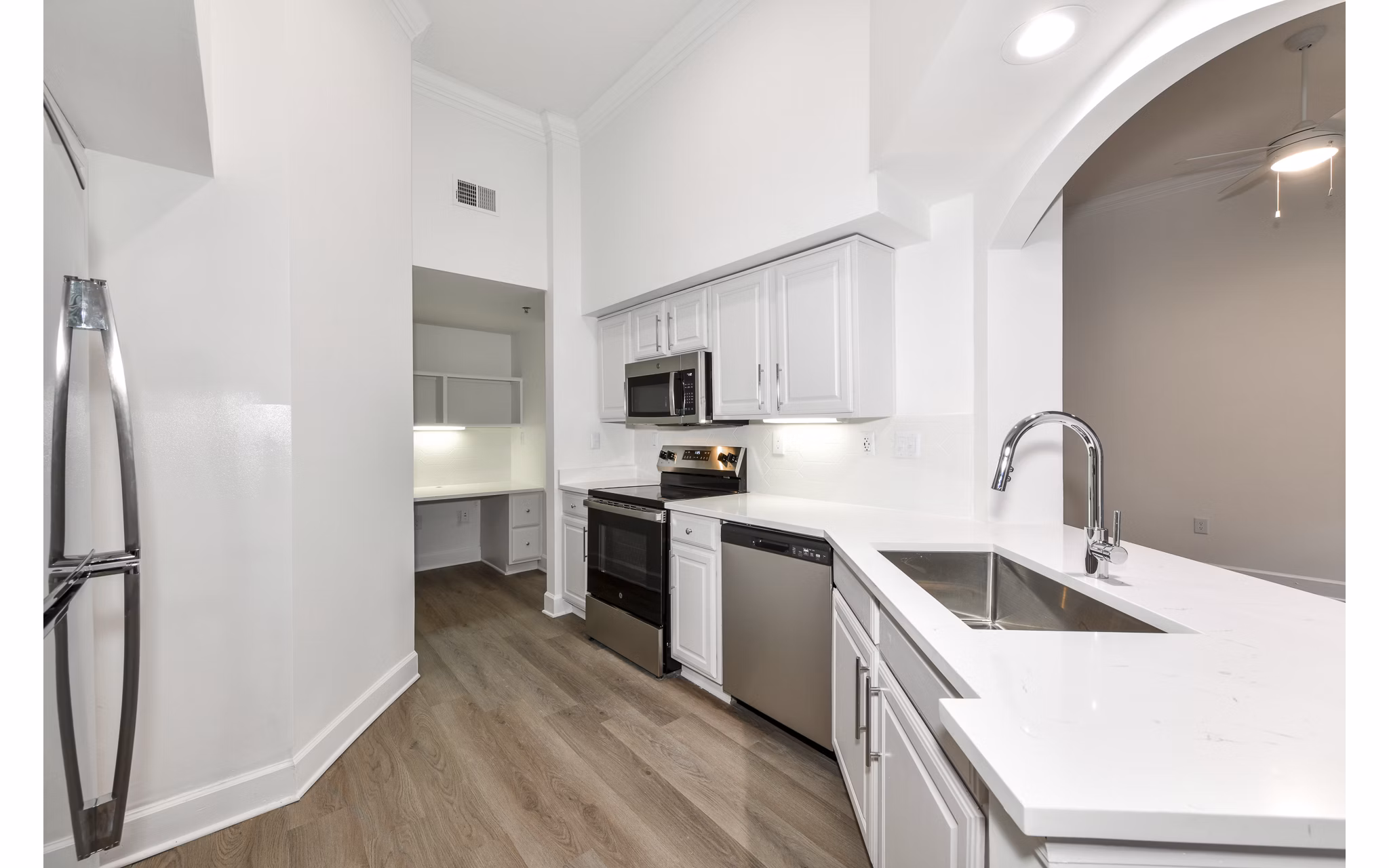 Modern kitchen with stainless steel appliances at Phipps Place Apartments, luxury living in the heart of the city