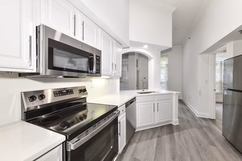 Contemporary kitchen with stainless steel appliances at Phipps Place Apartments