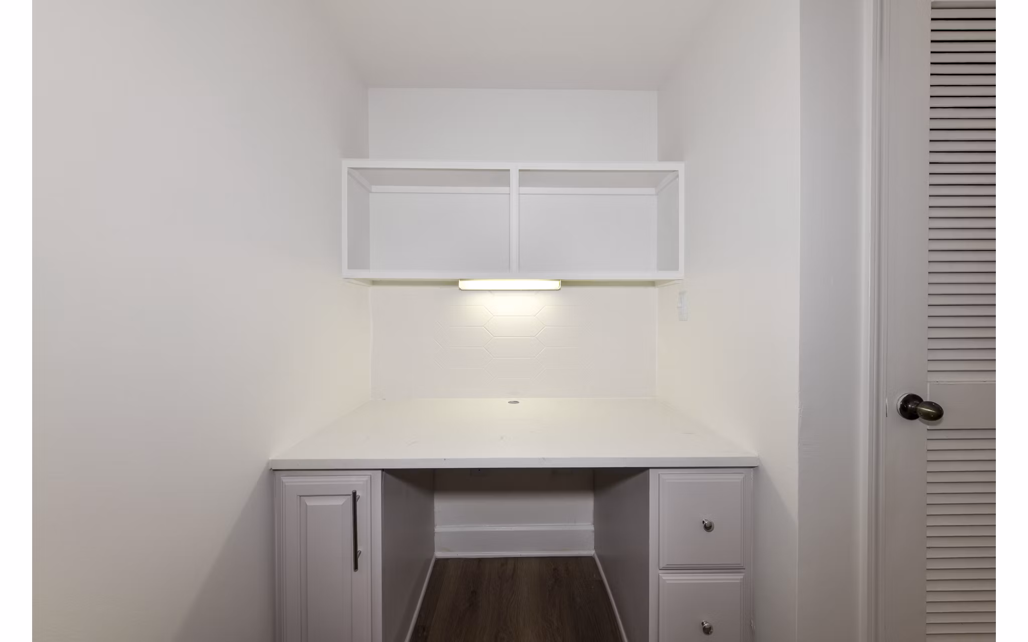 Cozy home office with modern furniture at Phipps Place Apartments, ideal for remote work and productivity in luxury surroundings