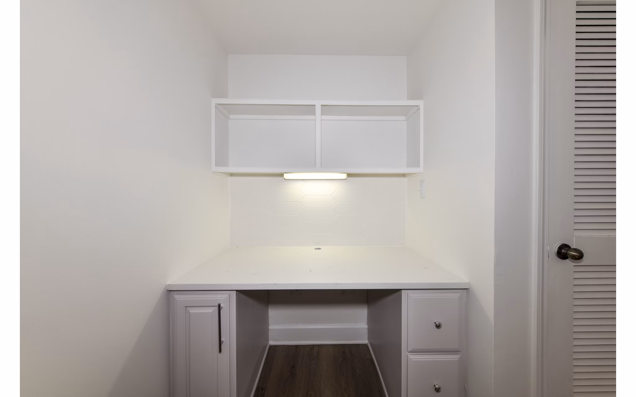 Cozy home office with modern furniture at Phipps Place Apartments, ideal for remote work and productivity in luxury surroundings