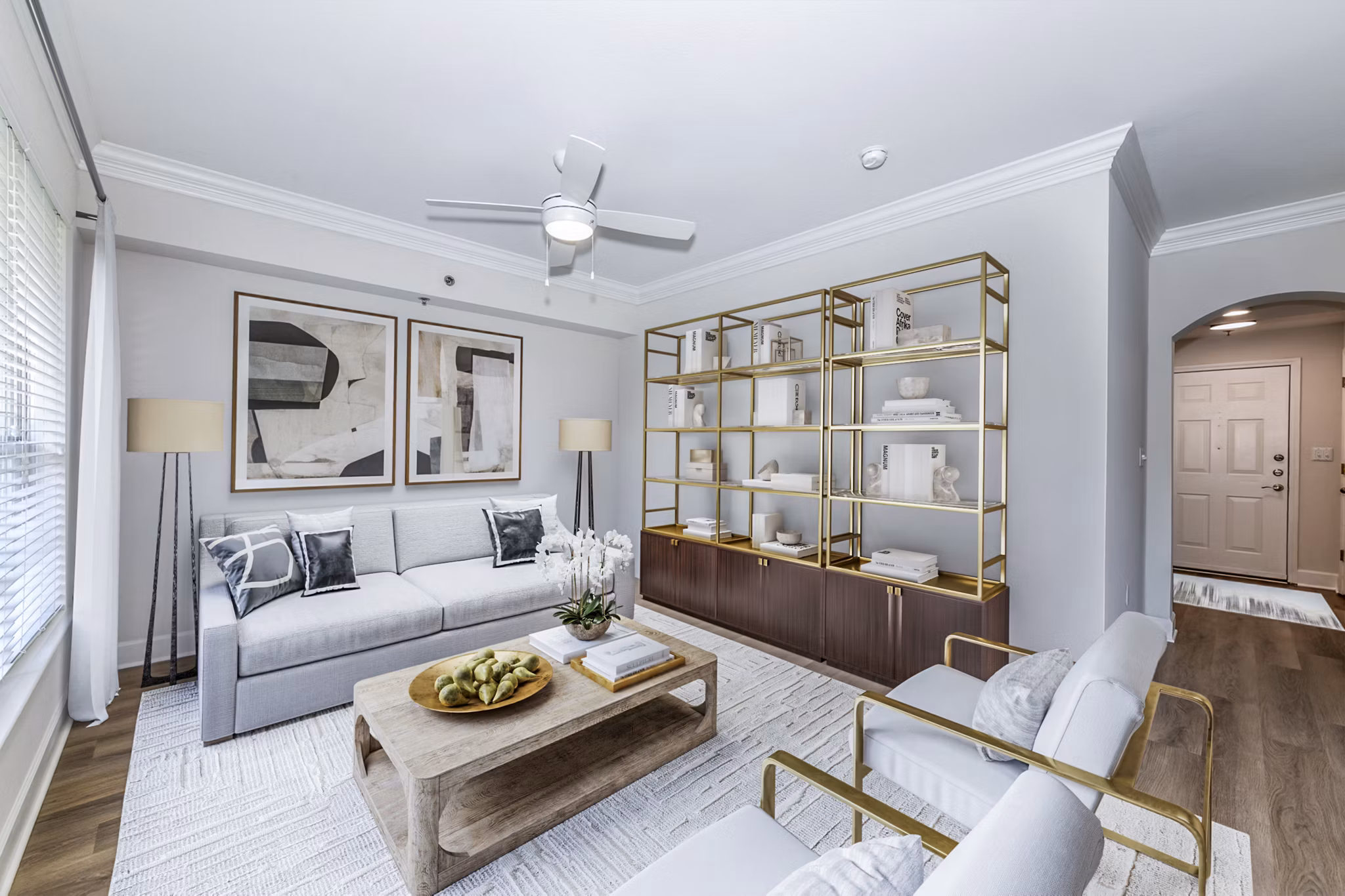 Living room with modern furniture and large windows at Phipps Place Apartments