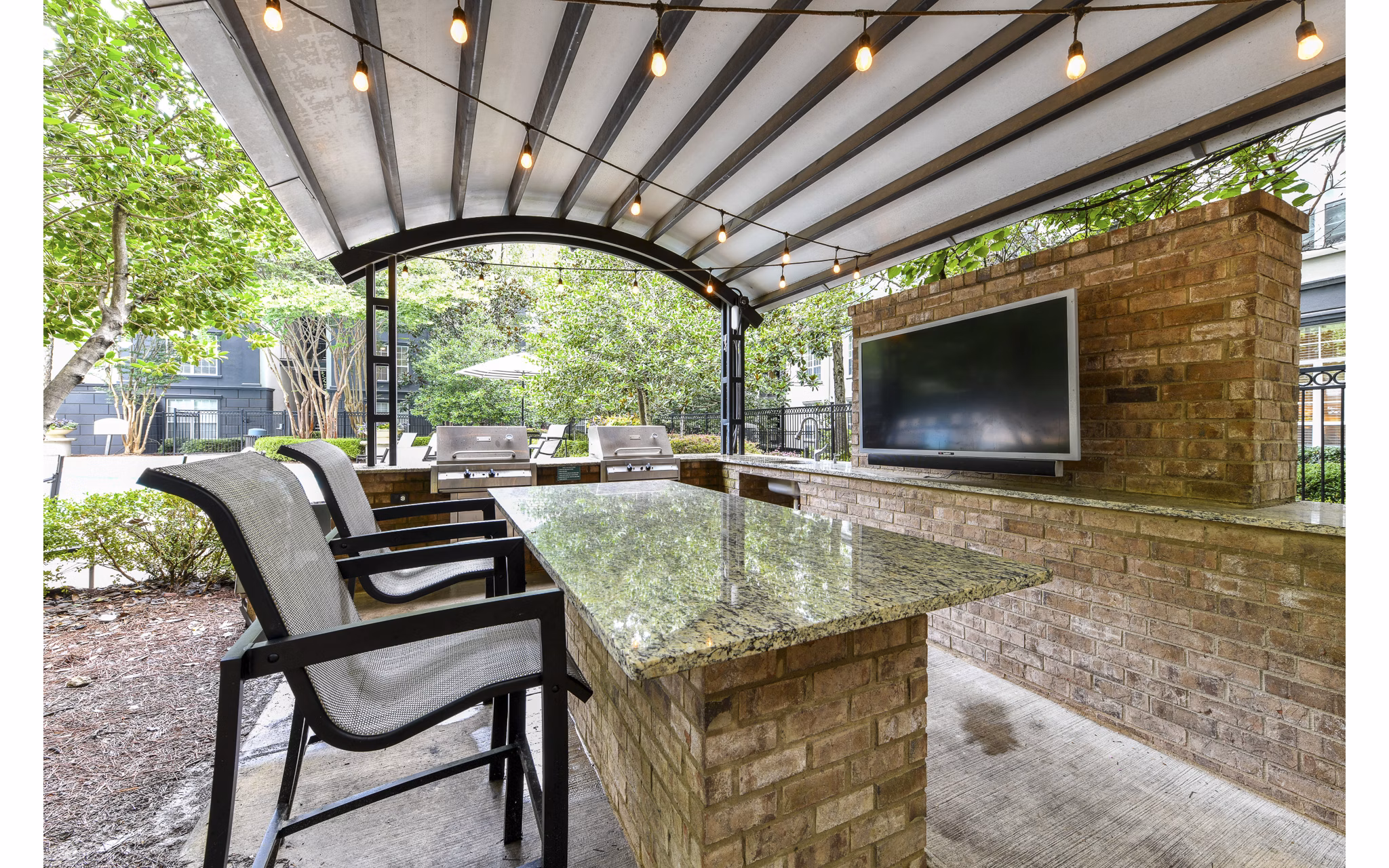 Grill area and stylish patio at Phipps Place Apartments, luxury living spaces perfect for outdoor gatherings