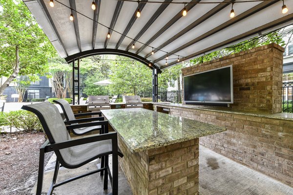 Grill area and stylish patio at Phipps Place Apartments, luxury living spaces perfect for outdoor gatherings