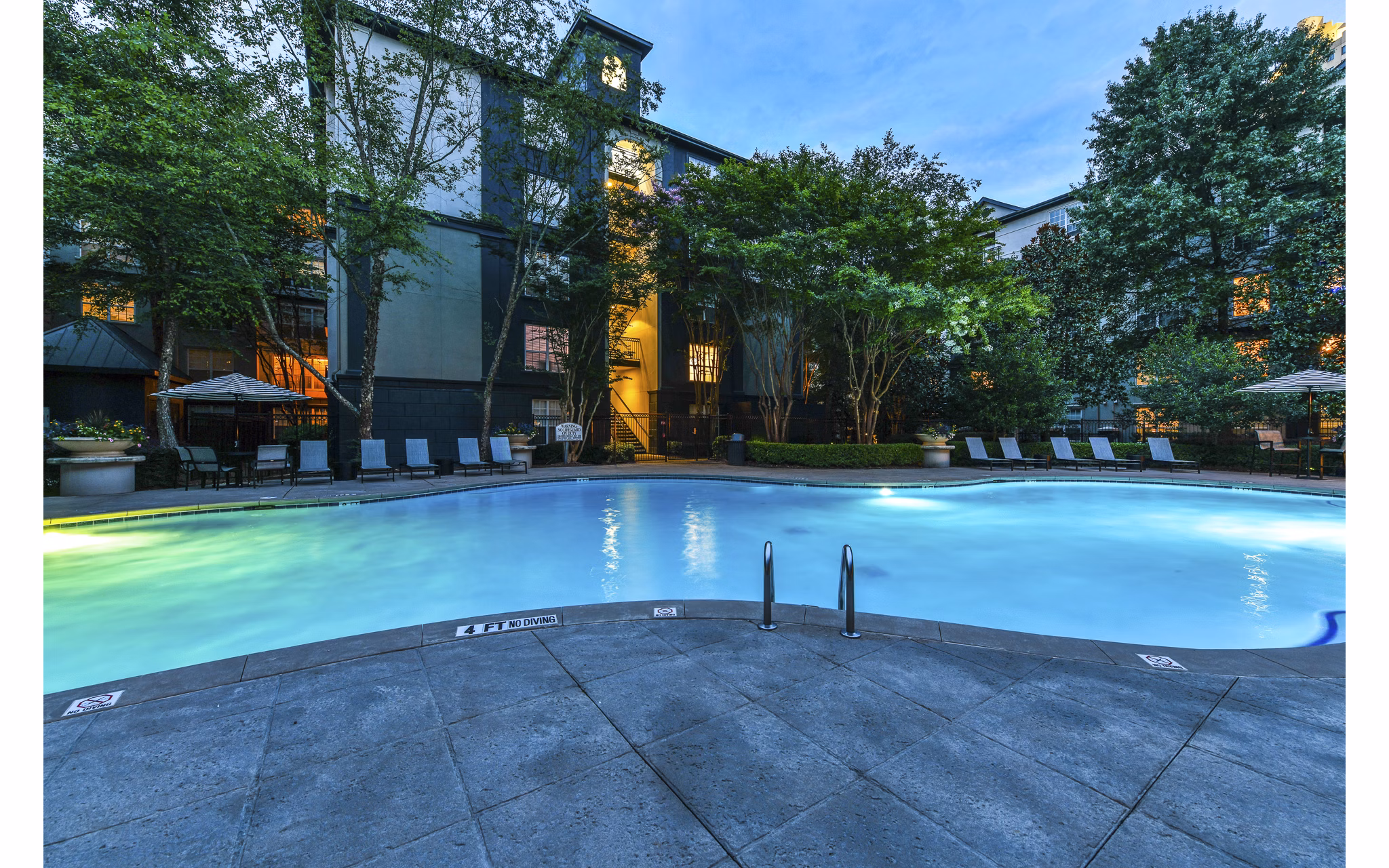 Luxurious poolside at Phipps Place Apartments with modern design and city views