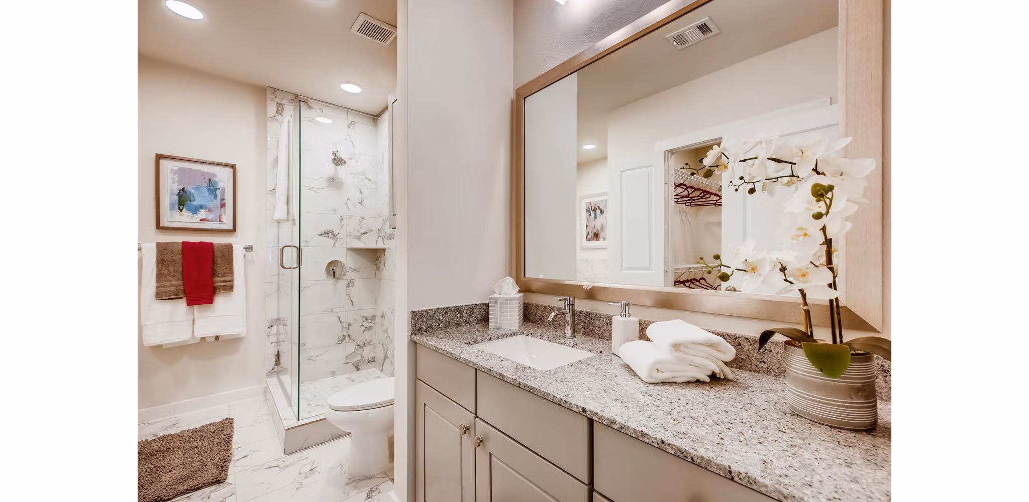 Bathroom featuring sleek fixtures and modern design at The Caroline Apartments