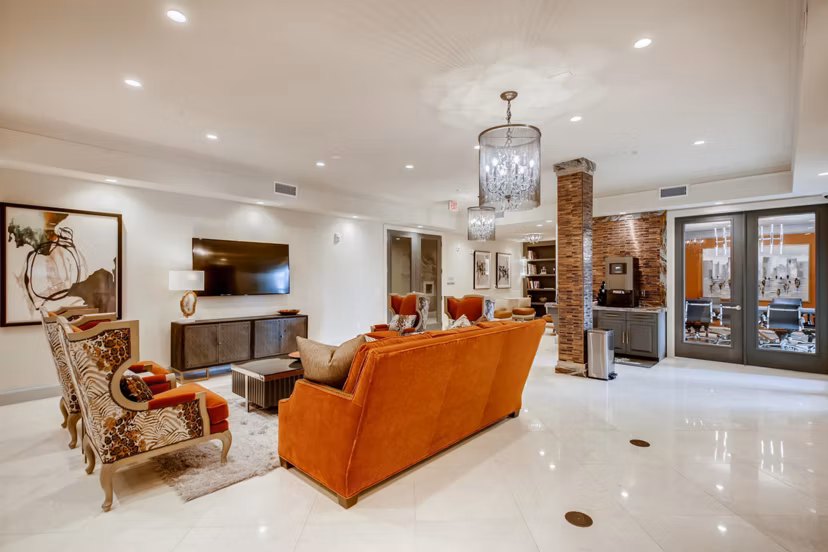 Luxurious clubhouse at The Caroline Apartments featuring modern seating and spacious design in a vibrant community setting
