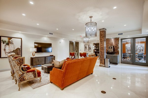 Luxurious clubhouse at The Caroline Apartments featuring modern seating and spacious design in a vibrant community setting