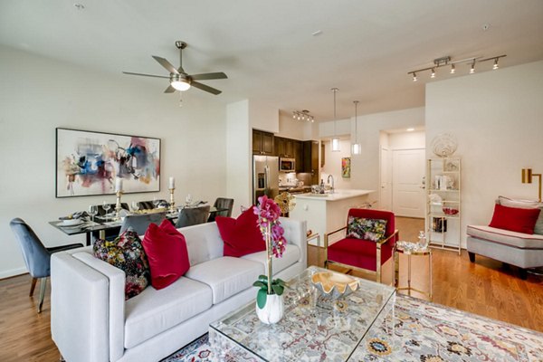 Spacious living room with modern decor at The Caroline Apartments