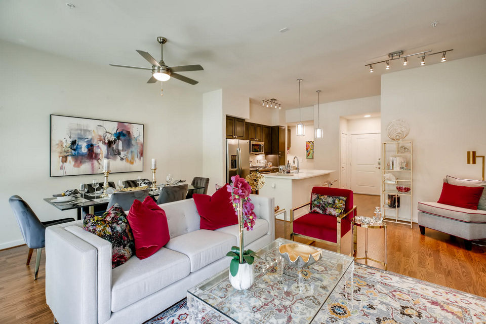 Spacious living room with modern decor at The Caroline Apartments