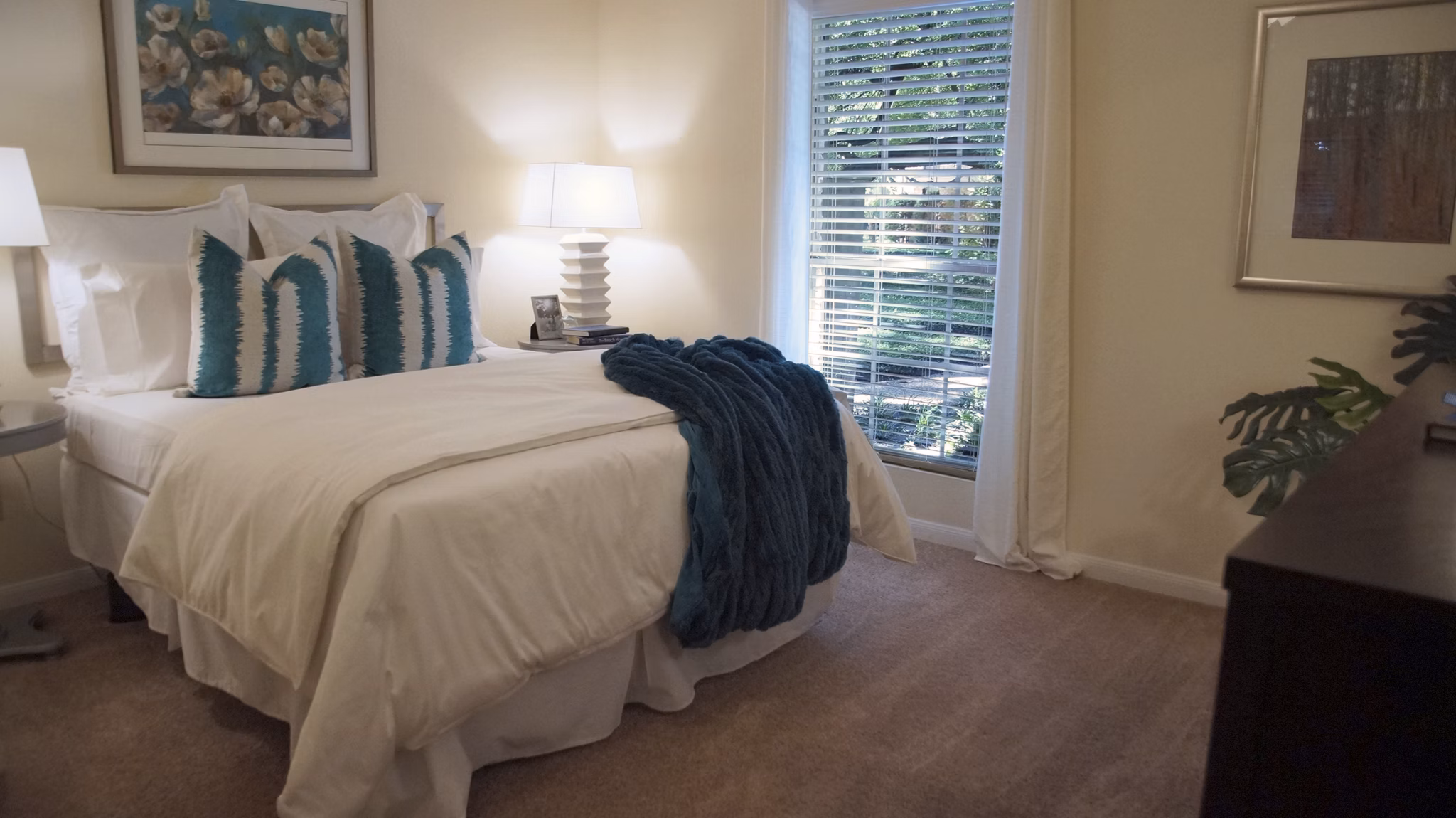 Cozy bedroom with modern decor in The Creole on Yorktown Apartments