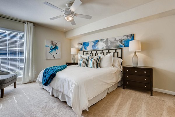 Modern bedroom with spacious layout and natural light at The Creole on Yorktown Apartments