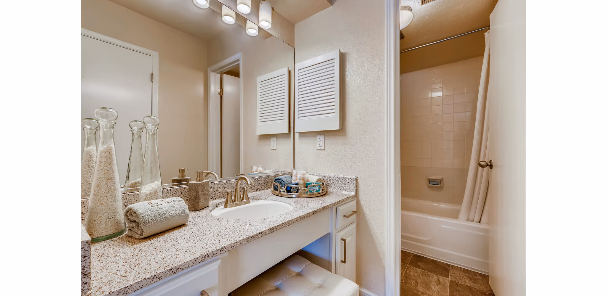 Bathroom with sleek modern fixtures at The Creole on Yorktown Apartments
