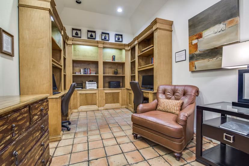 Business center with modern workstations at The Creole on Yorktown Apartments