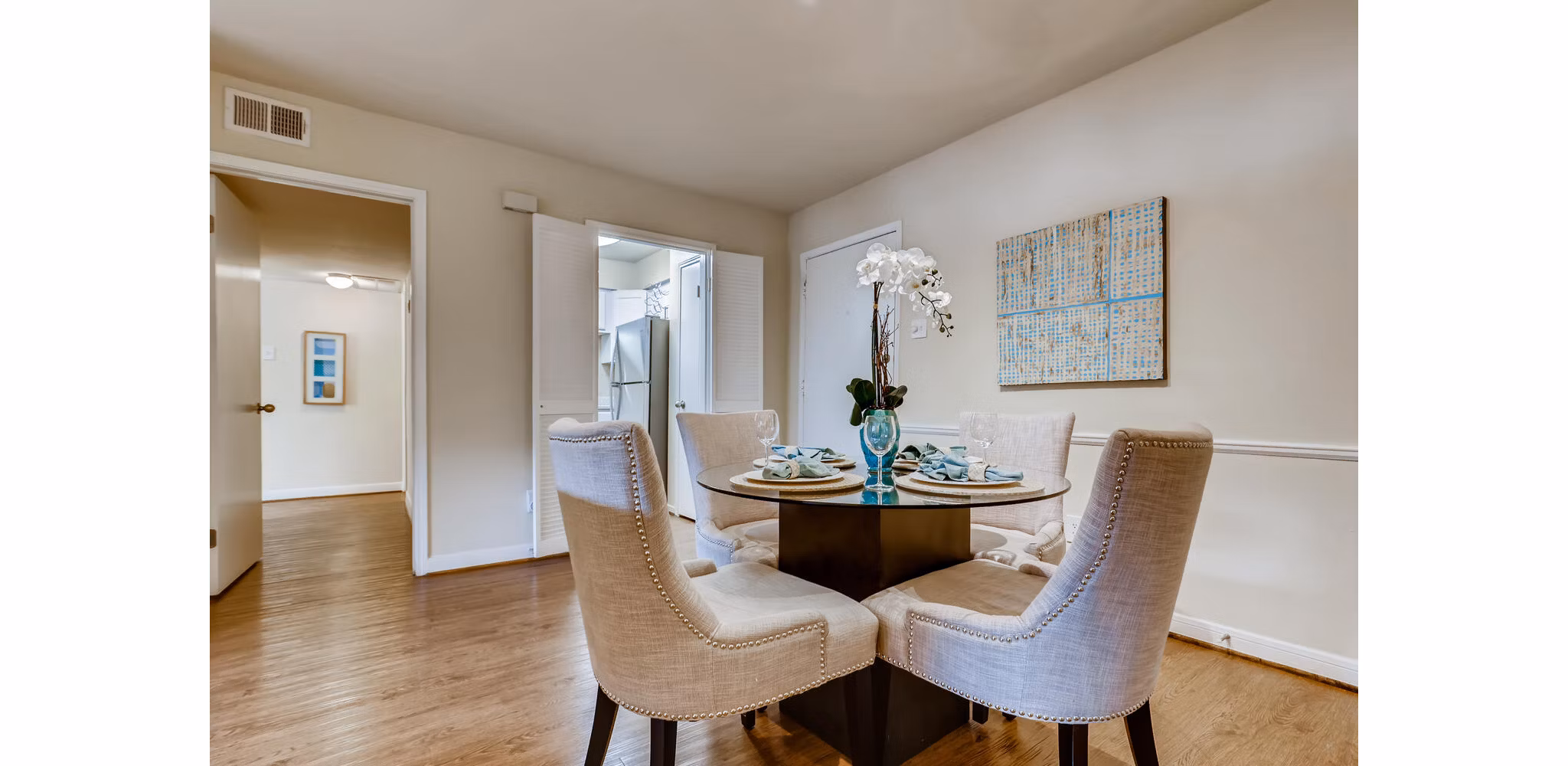 Elegant dining area with modern furnishings in The Creole on Yorktown Apartments