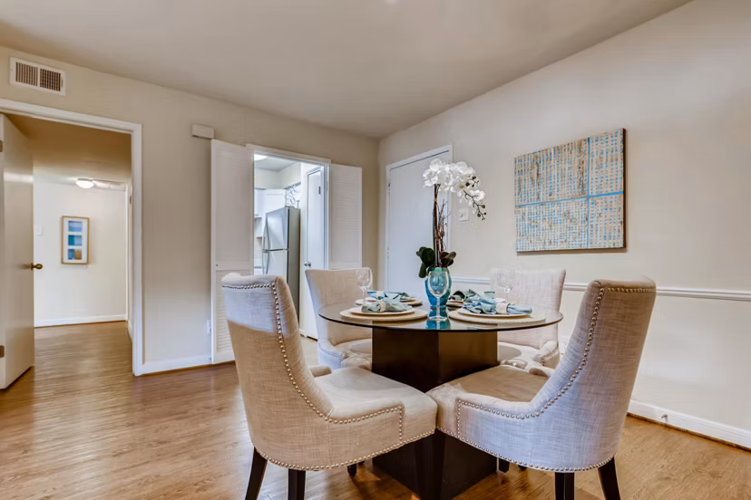 Elegant dining area with modern furnishings in The Creole on Yorktown Apartments